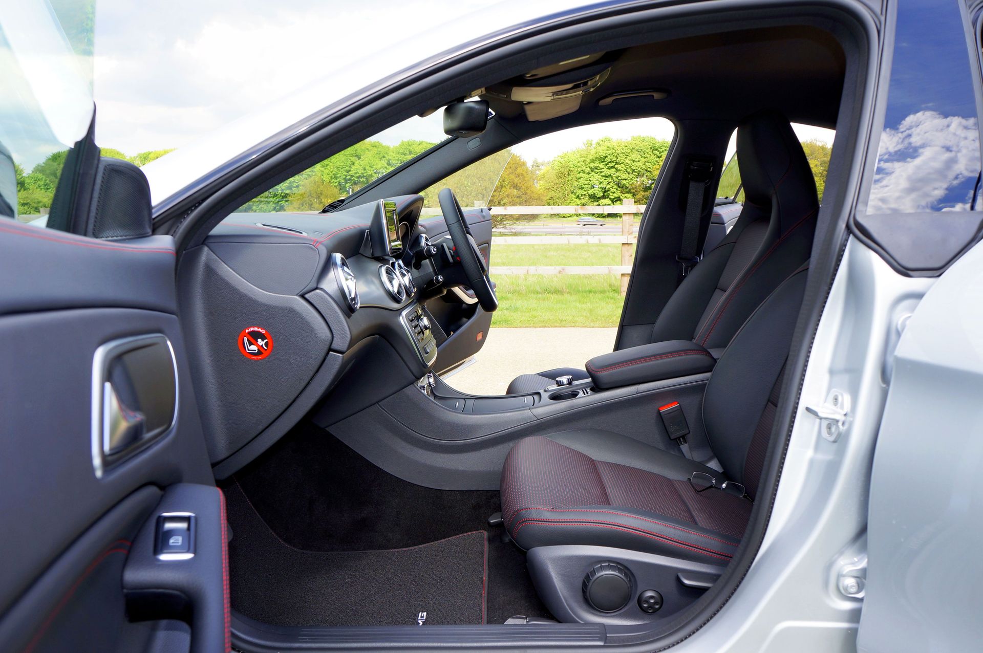 Modern luxury car interior featuring sleek design, leather seats, and advanced dashboard technology.